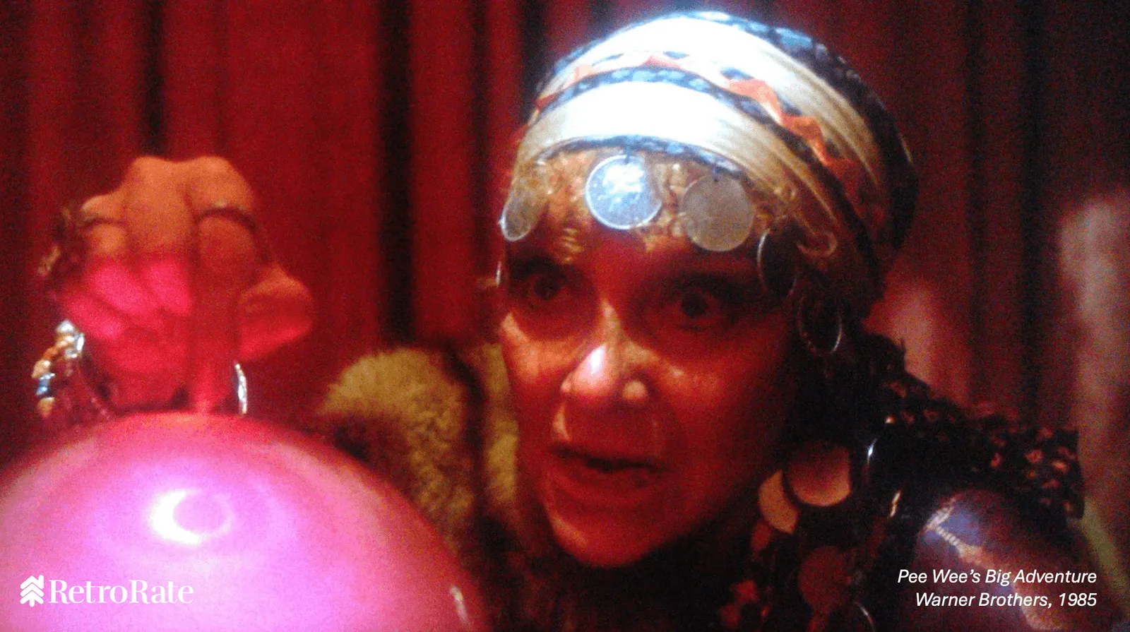 Madame Ruby from Pee Wee’s Big Adventure hovernig over a crystal ball.